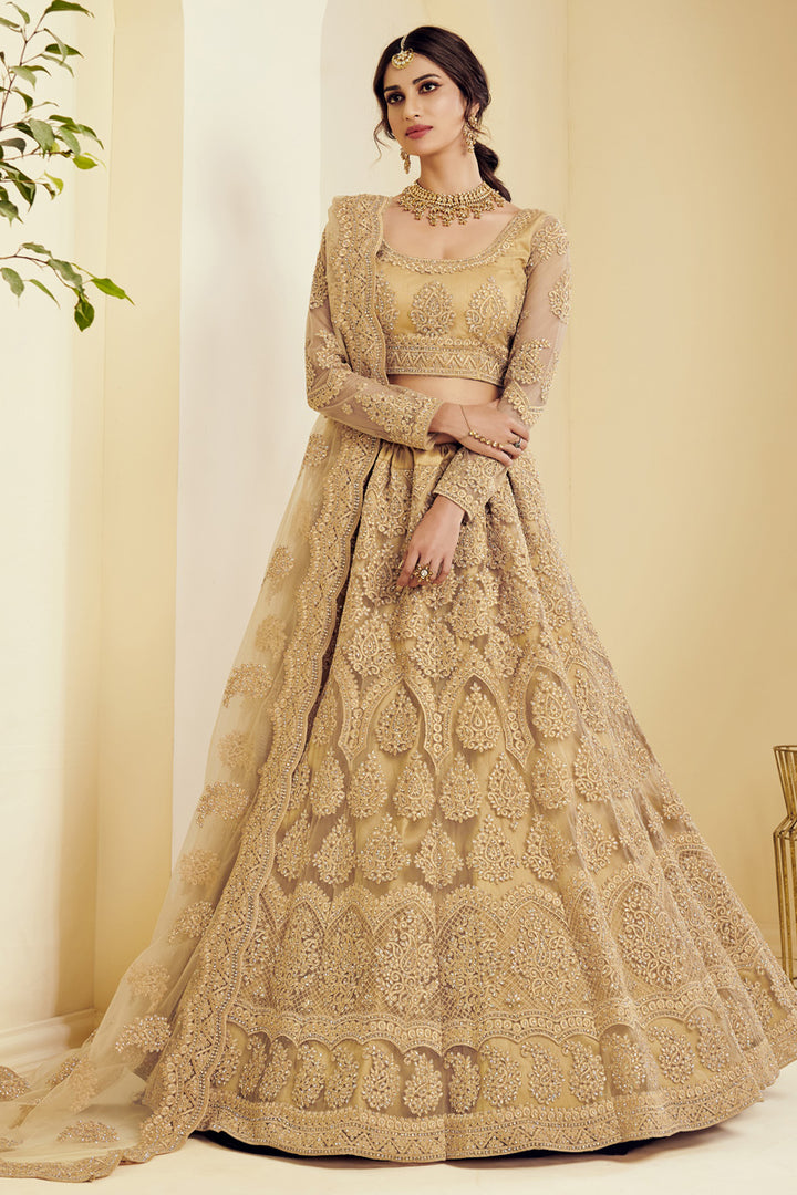 Fancy Golden Color Sangeet Wear Embroidered Net Fabric Lehenga