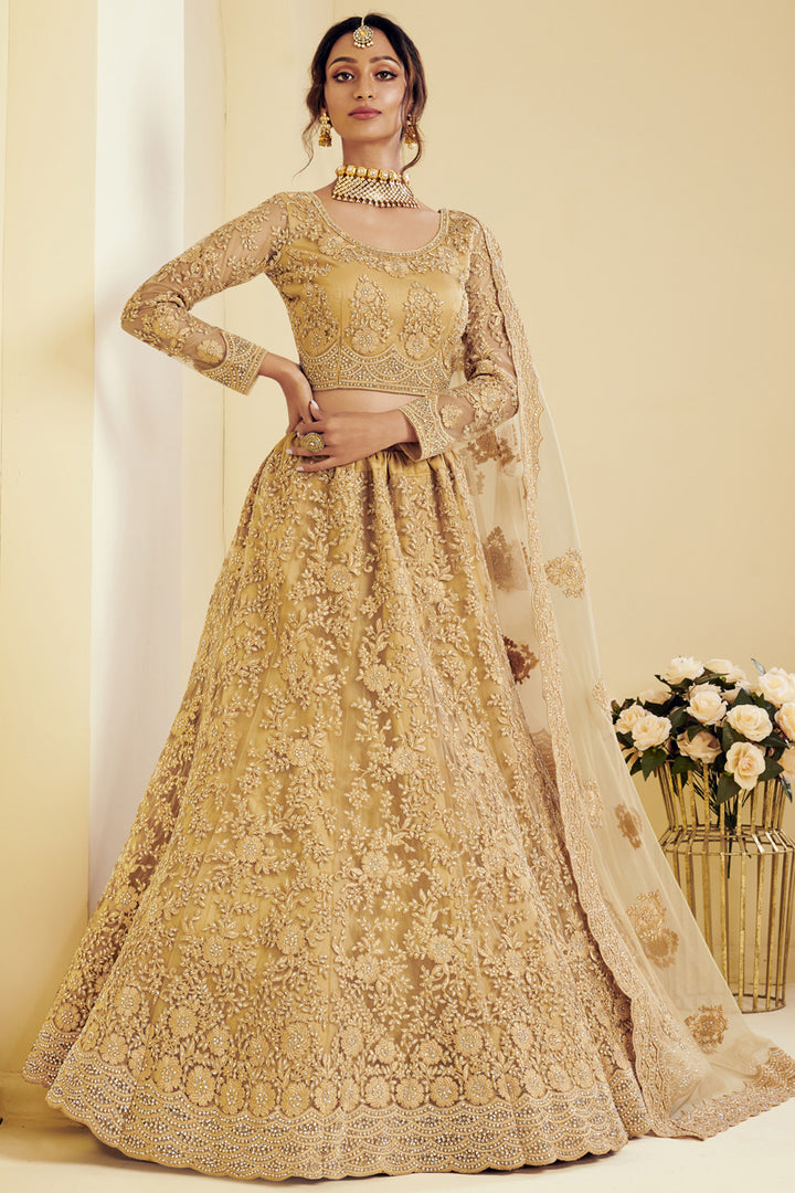 Fancy Golden Color Sangeet Wear Embroidered Lehenga In Net Fabric