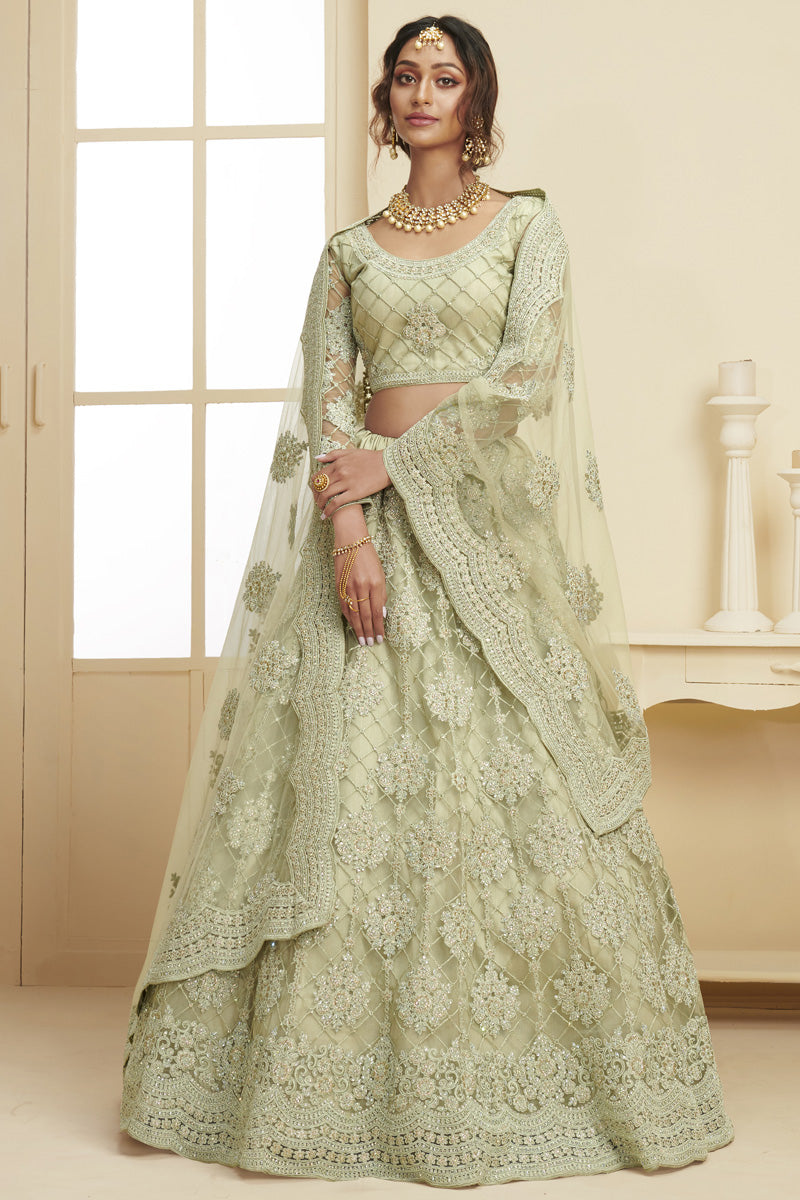 Fancy Net Fabric Sangeet Wear Embroidered Sea Green Color Lehenga