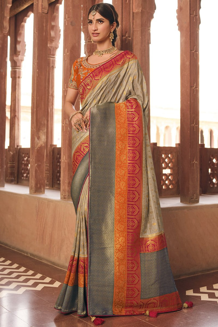 Art Silk Fabric Weaving Work Cream Color Festive Wear Saree With Embroidered Blouse