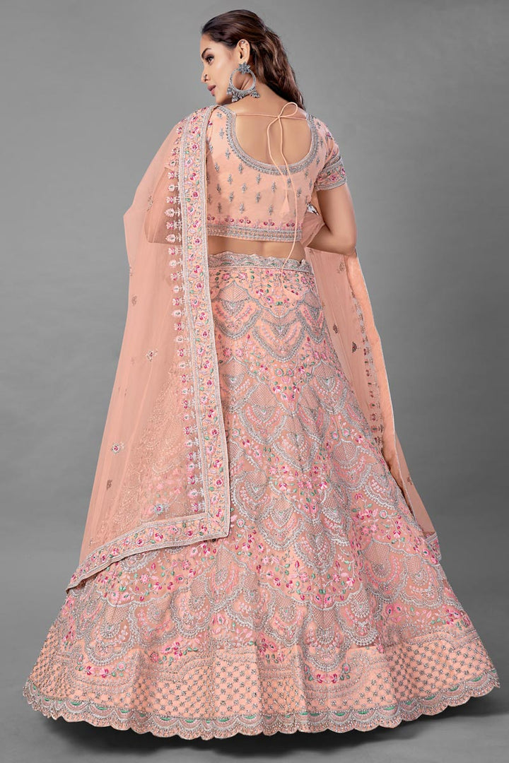 Net Fabric Peach Color Wedding Wear Thread Embroidered Lehenga Choli