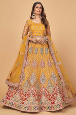 Load image into Gallery viewer, Mustard Color Wedding Wear Thread Embroidered Work Captivating Lehenga With Dupatta In Net Fabric
