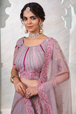 Load image into Gallery viewer, Lavender Color Net Fabric Wedding Wear Parity Lehenga Choli

