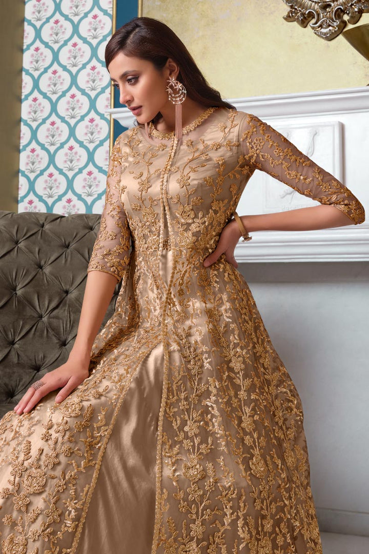 Sangeet Wear Chikoo Color Elegant Embroidered Gown Style Anarkali Suit In Net Fabric