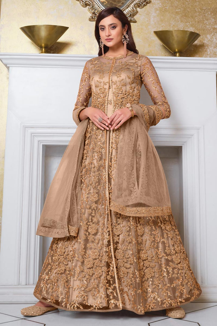 Sangeet Wear Chikoo Color Elegant Embroidered Gown Style Anarkali Suit In Net Fabric